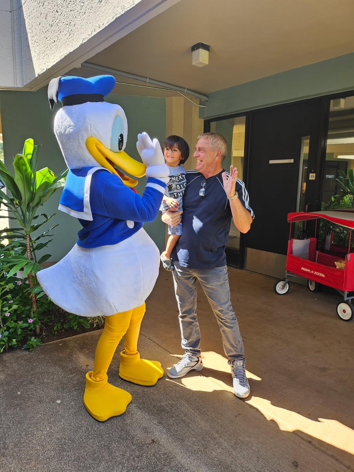 Paul Tonnessen and Pi'ilani Gamponia said hello to Donald Duck in this 2023 photo. Courtesy photo