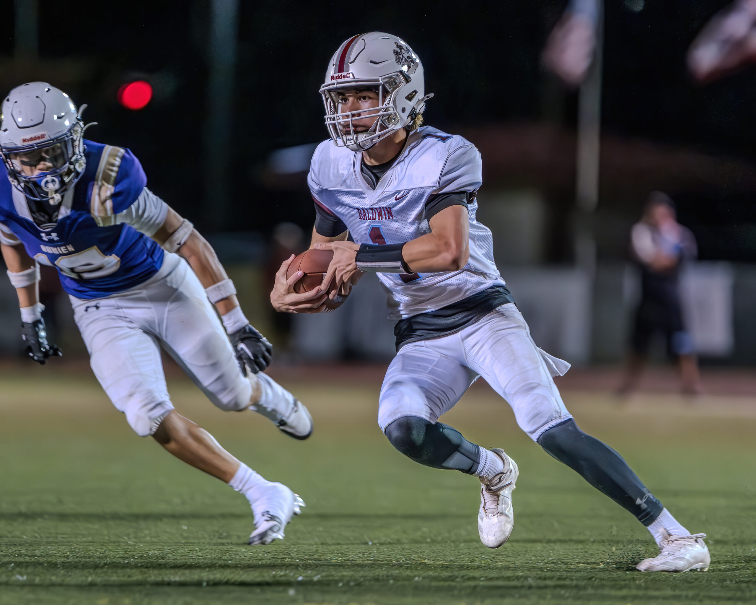 Baldwin High School quarterback Jorden Carbonell runs the ball in the Bears' 28-14 loss to Damien in a Division I state quarterfinal at Farrington High School. BRIAN BAUTISTA / Scoring Live photo