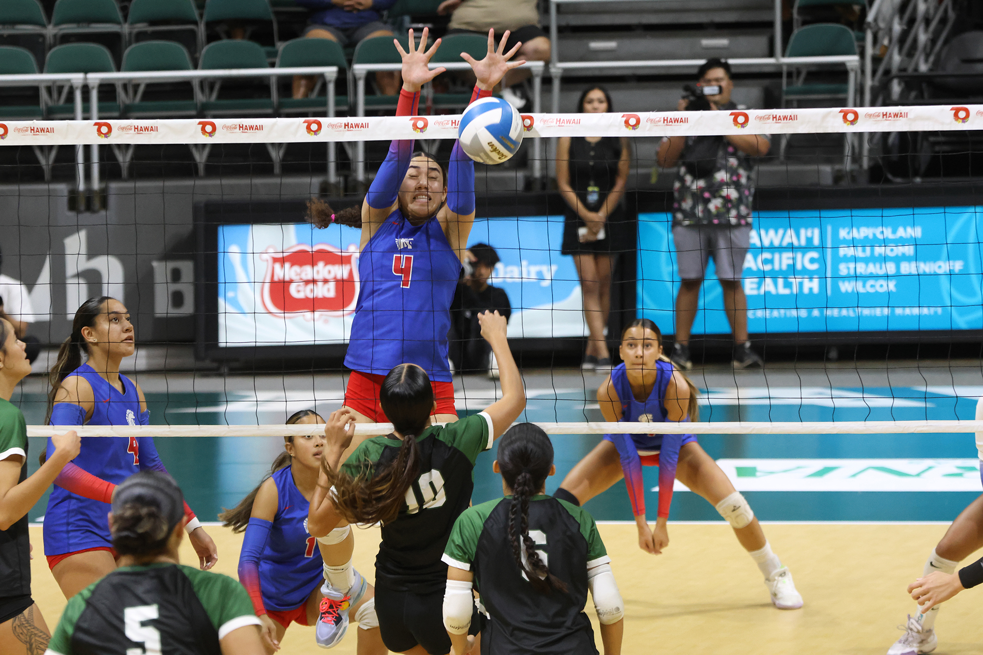 Seabury Hall's Delaney Tauaese (4) blocks a Kapa'a shot in the Spartans five-set loss to the Warriors in the Division II state championship match on Saturday. ScoringLive / GREG YAMAMOTO photo
