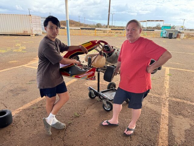 Alex Eckert (left), a 14-year-old go-kart racer, stands with his father Gary Eckert on Nov. 1 at the Masui Go Karters Association track in Pu'unene. HJI / ROB COLLIAS photo