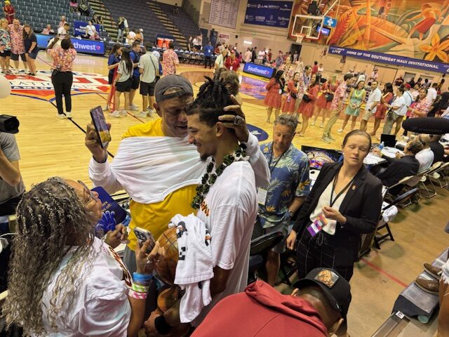 Chad Baker-Mazara (middle, with lei) celebrates with his parents Derrek Baker and Carmen Mazara after Baker-Mazara led Southern California to the Southwest Maui Invitational championship on Wednesday at the Lahaina Civic Center. HJI / ROB COLLIAS photo