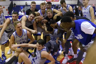 The Chaminade University of Honolulu basketball team celebrates its 96-72 win over California on Nov. 22, 2017. Chaminade University Athletics photo