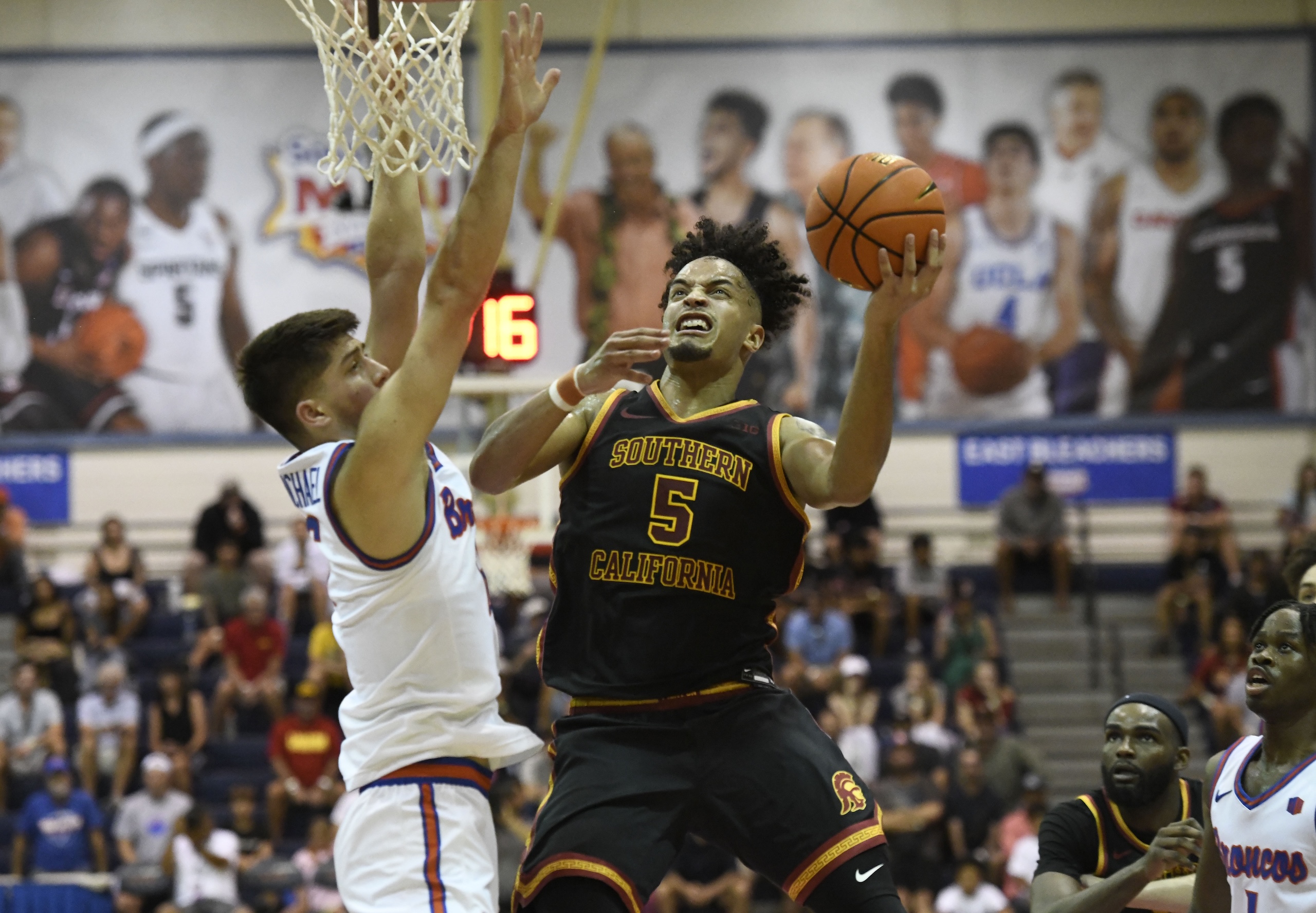Southern California's Terrance Willams II drives against Boise State's Pearson Carmichael in the first half Monday. The Trojans won the game 70-67. MATTHEW THAYER photo