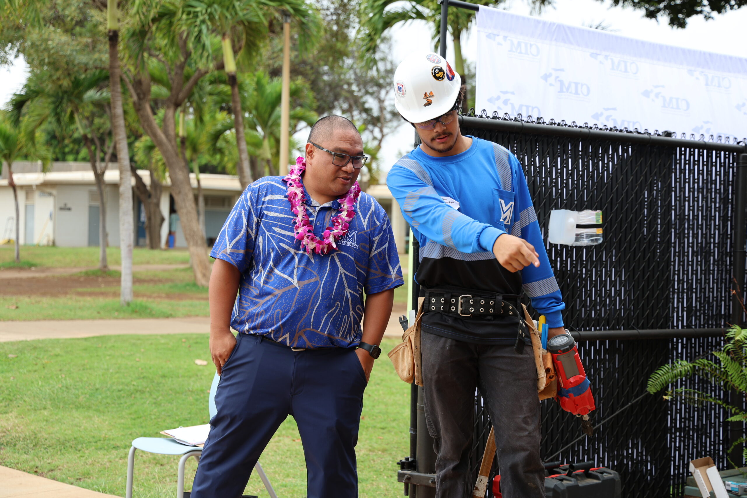 Maui High Schoopl construction teacher Julio Bayez discusses the project with senior Kalani Izarraga on Friday. ALEIZAY ANGEL photo