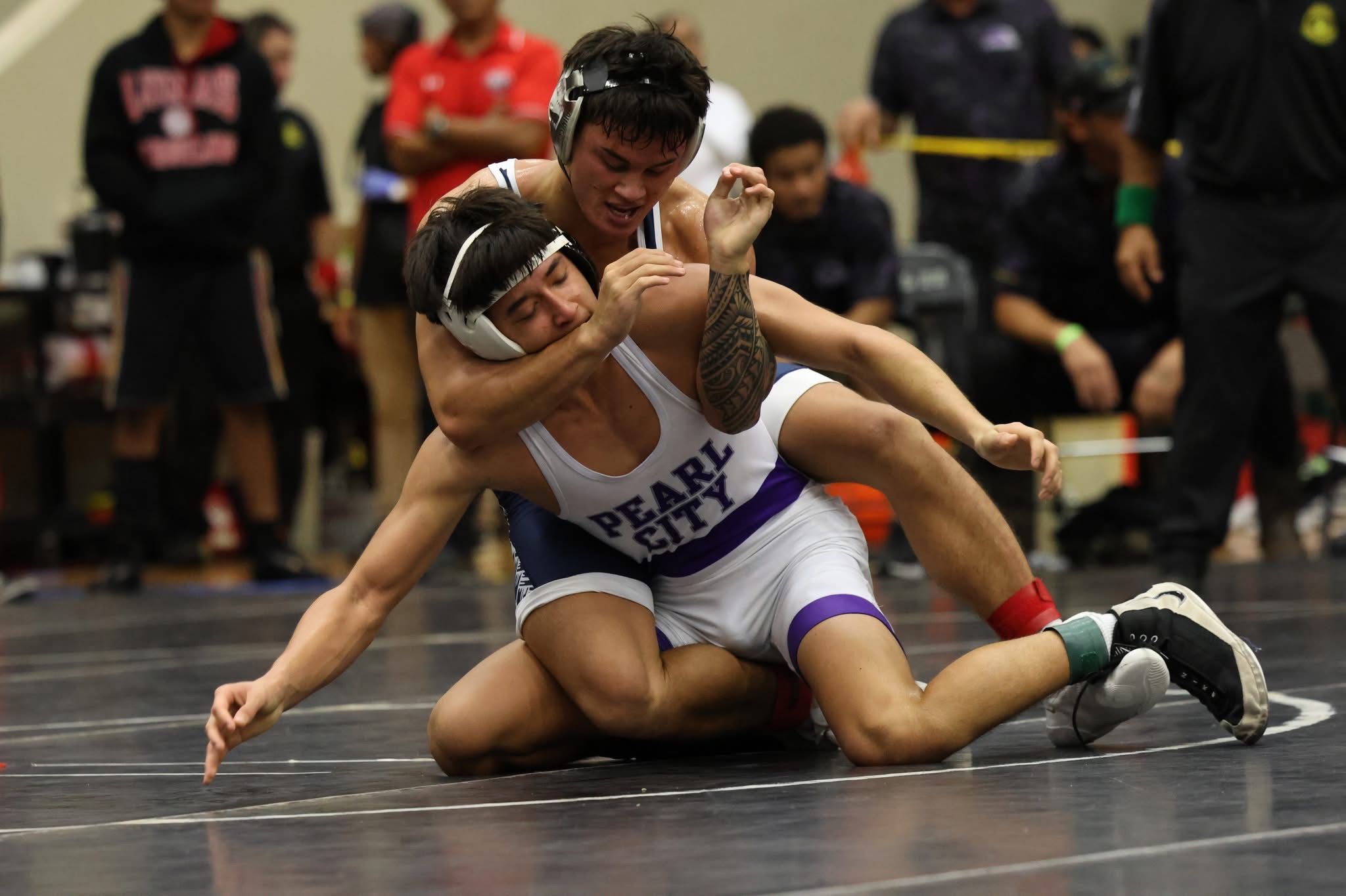 Kamehameha Schools Maui's Blake Abernathy (back) controls Pearl City's Miles Uyemura III in their 144-pound final at the Garner Ivey Maui Invitational Wrestling Tournament. Abernathy won the match 1-0. JASON HAYASE photo