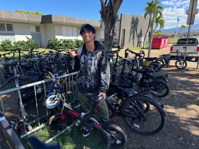 Jerry Lee Dela Cruz Feernandez, a 16-year-old Maui High School junior, is shown here with his e-bike that he rides to school daily. HJI / ROB COLLIAS photo