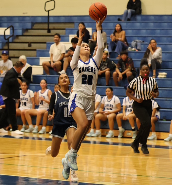 Naiara Bal, the only senior on the Maui High School girls basketball team, goes up for a left-handed layup in a game against Kamehameha Maui earlier this year. REID YAMAMOTO photo