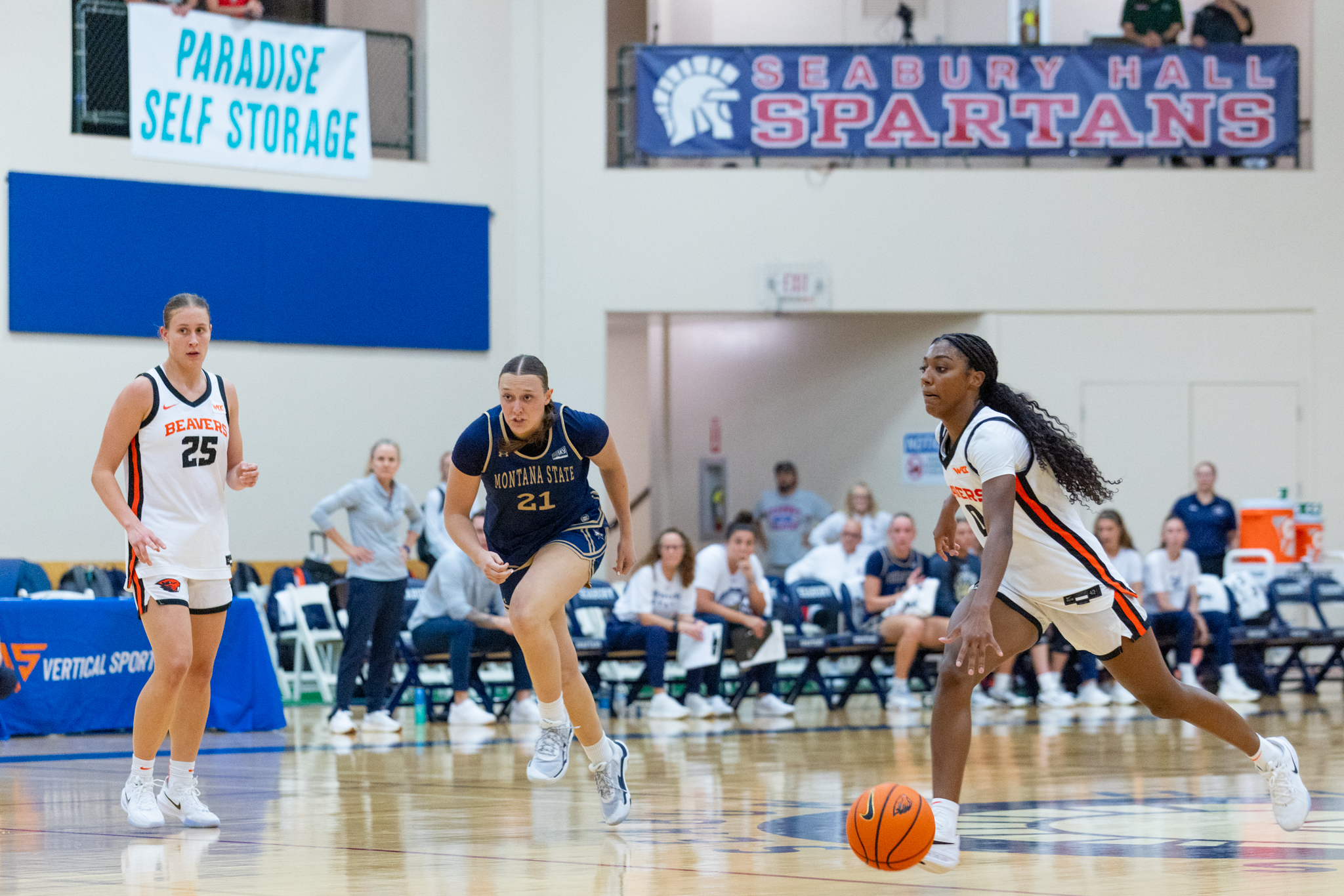 Oregon State University's Tiara Bolden dribbles up the court as Montana State's Brianne Bailey (21) and Oregon State's Keira Lindemans (25) look on during the Maui Classic women's basketball tournament at Seabury Hall on Friday. The Beavers won the game in their tournament 53-51. Bryan Berkowitz / Seabury Hall.photo
