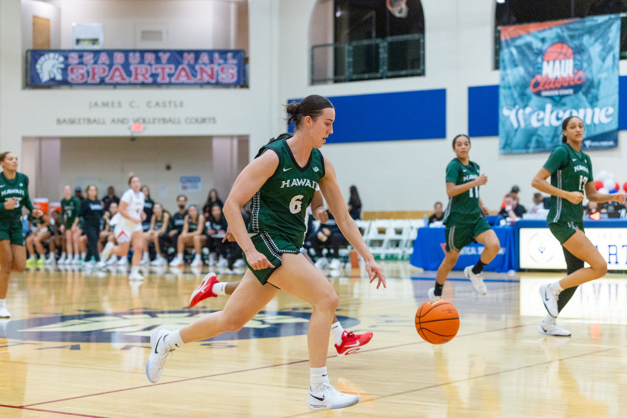 Kyra Webb of the University of Hawai'i Rainbow Wahine women's basketball team dribbles up court in UH's 67-58 win over Liberty Friday. Bryan Berkowitz / Seabury Hall photo