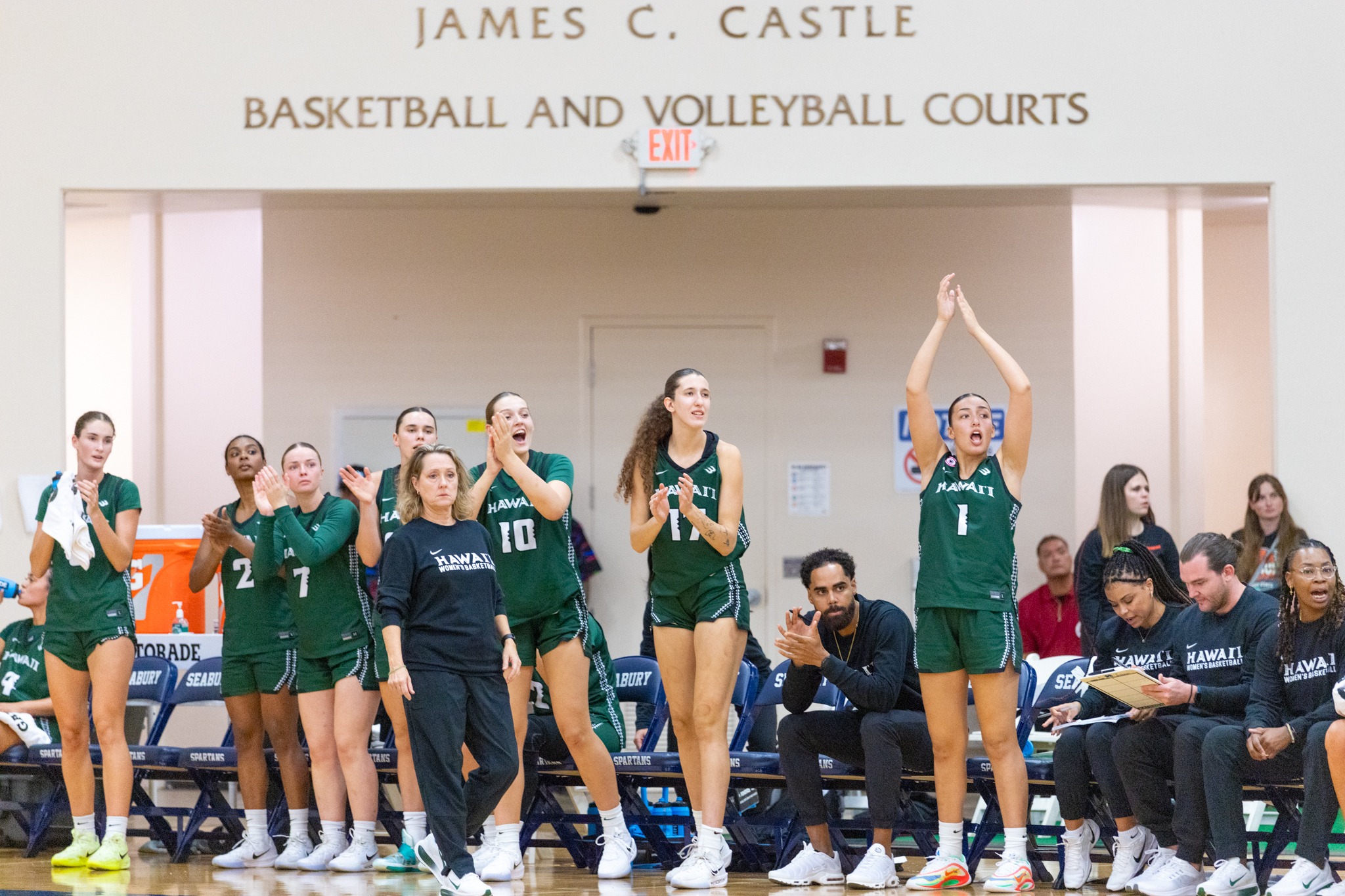 The University of Hawai'i bench celebrates in the Rainbow Wahine's 67-58 win over Liberty on Friday night in the Maui Classic at Seabury Hall. Bryan Berkowitz / Seabury Hall photo