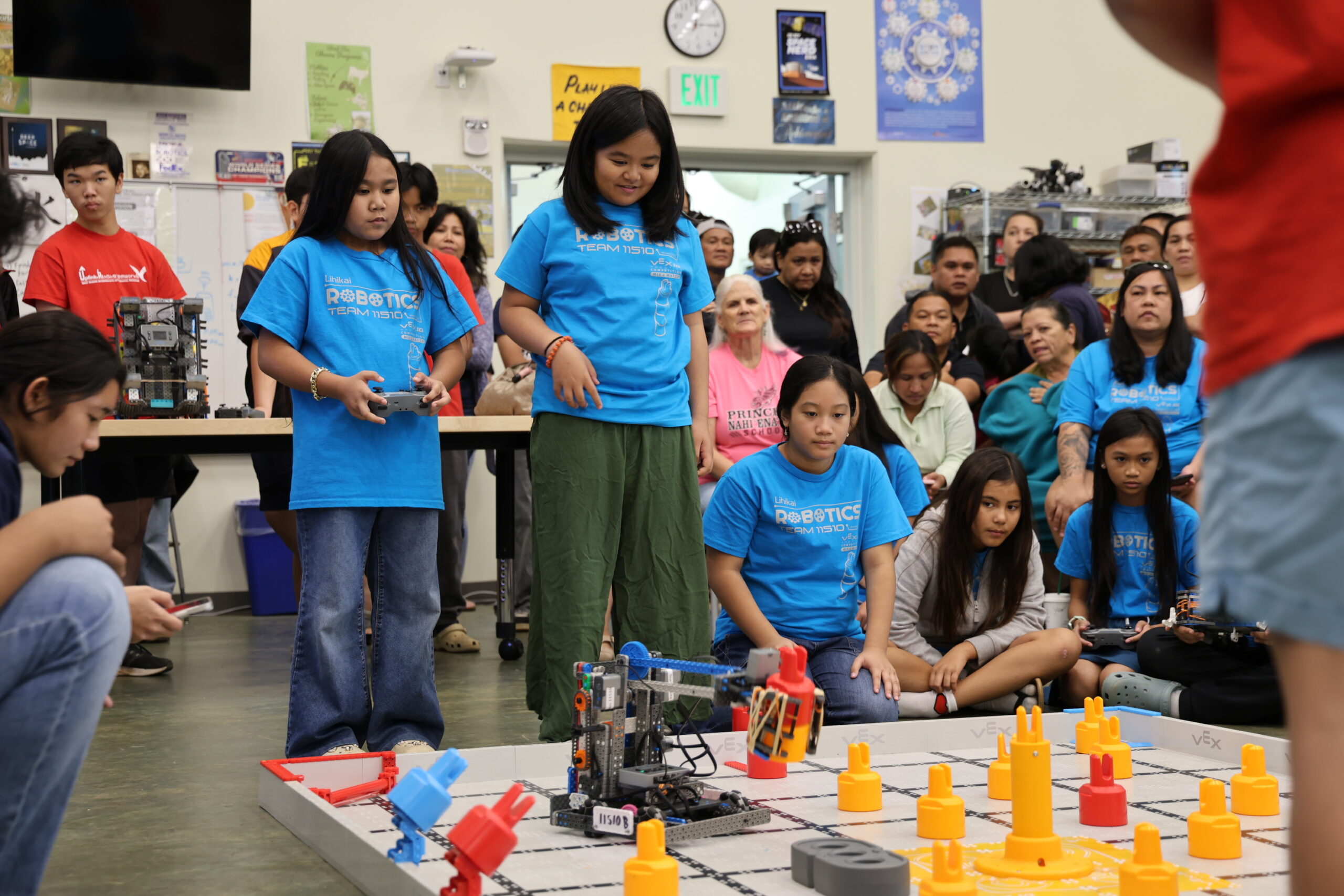 Lihikai Elementary School 4th-graders Zhaylie Antonio, Aria Sanado, and (sitting) Kate Pagaduan compete in a finals match. ALEIZAY ANGEL photo