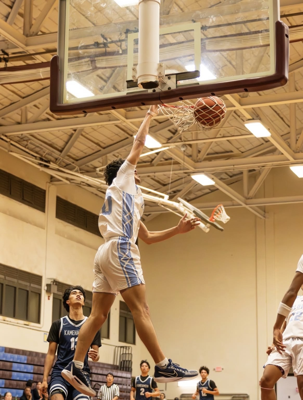 Baldwin High School's Dylan Kuia throws down a dunk in an 88-70 loss to Kamehameha Schools Kapalama on Nov. 29, 2025, at the Jon Garcia Gym. KIM TENGAN photo