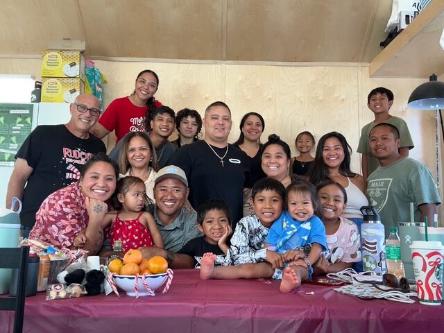 Nineteen members of the Rogers 'Ohana pose for this photo on Christmas Day inside their two-bedroom apartment of Liko and Sissy Rogers at Kilohana, a FEMA-funded housing project in Lahaina. Courtesy photo
