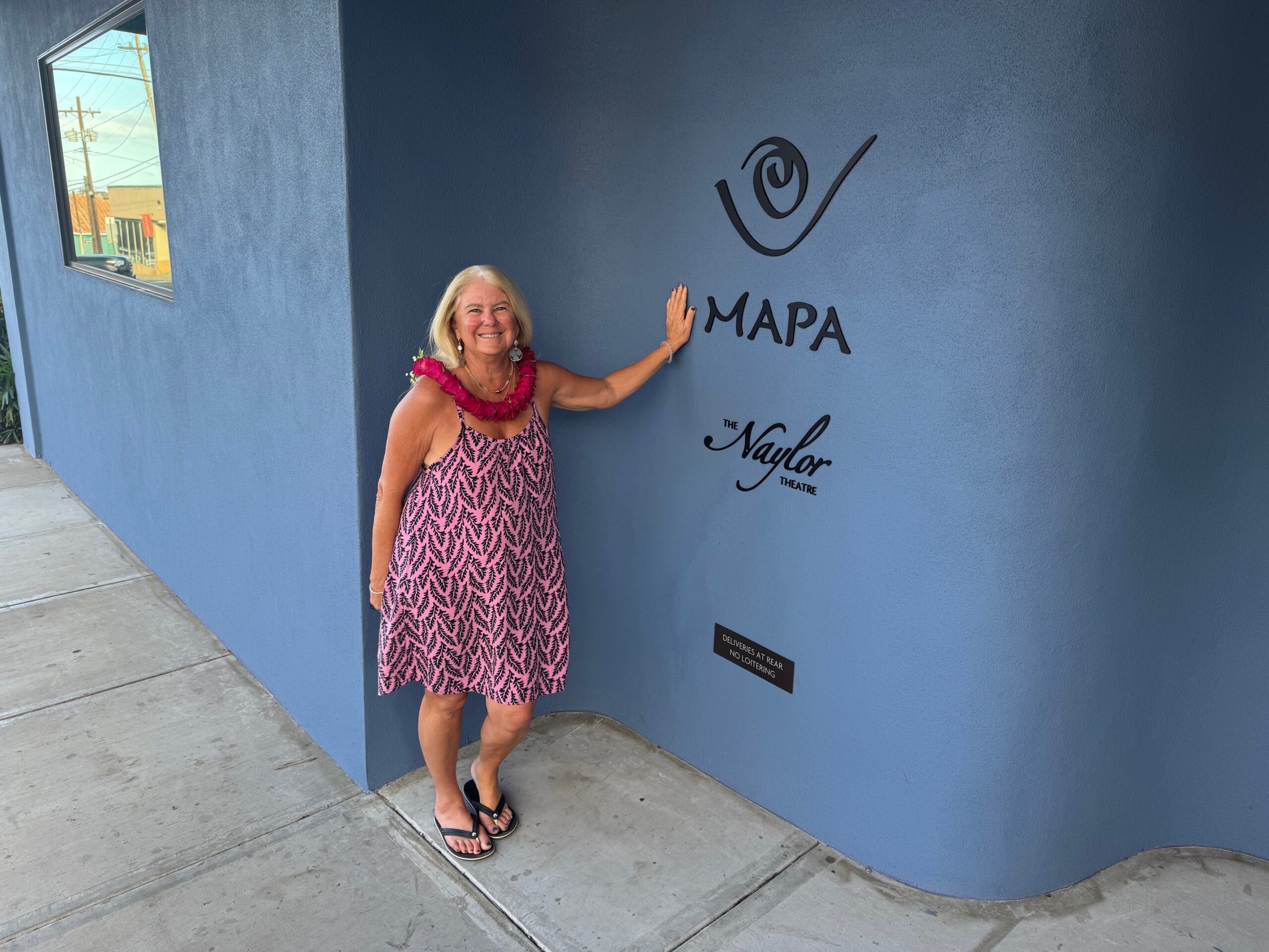 Philanthropist Susan Naylor stands next to the sign at the entrance to The Naylor Theatre on Jan. 7, 2026, prior to the facility's official opening night. HJI / ROB COLLIAS photo