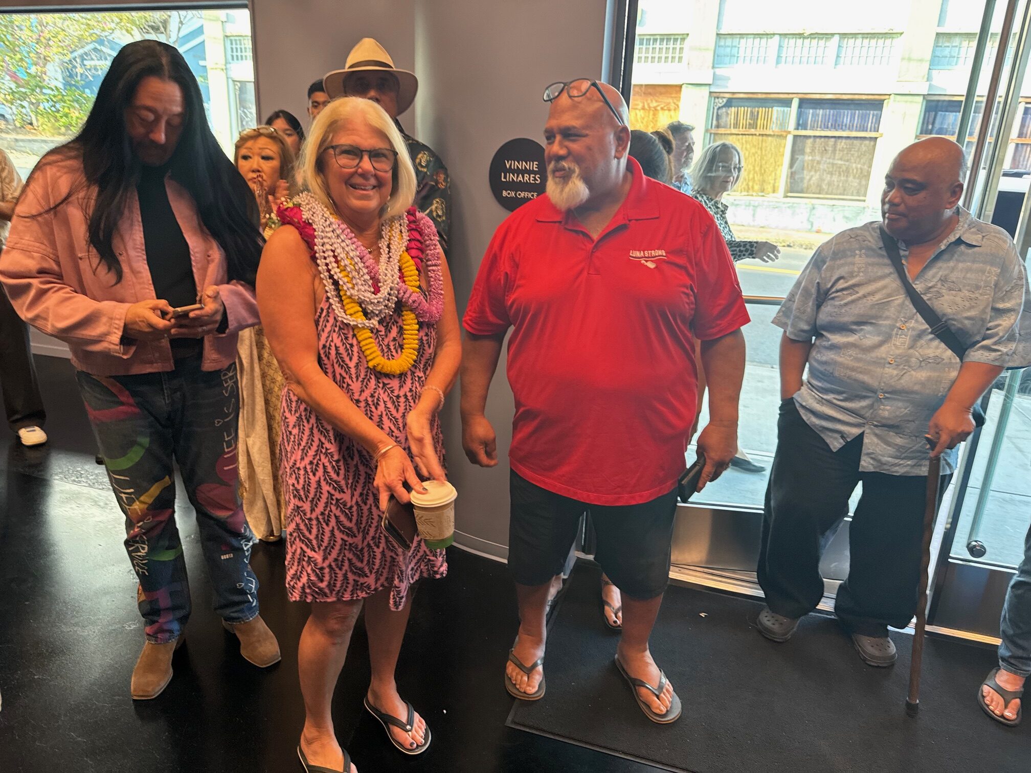 Philanthropist Susan Naylor stands next to retired Maui Police Department officer Lawrence Kauha'aha'a in the lobby of The Naylor Theatre on Jan. 7, 2026, prior to the facility's official opening night. HJI / ROB COLLIAS photo