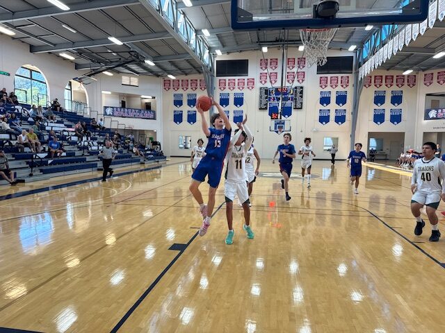 Seabury Hall's Peter Ruegsegger shoots over Hana's Ulumana Cantero in the Spartans' 68-23 win on Saturday. HJI / ROB COLLIAS photo