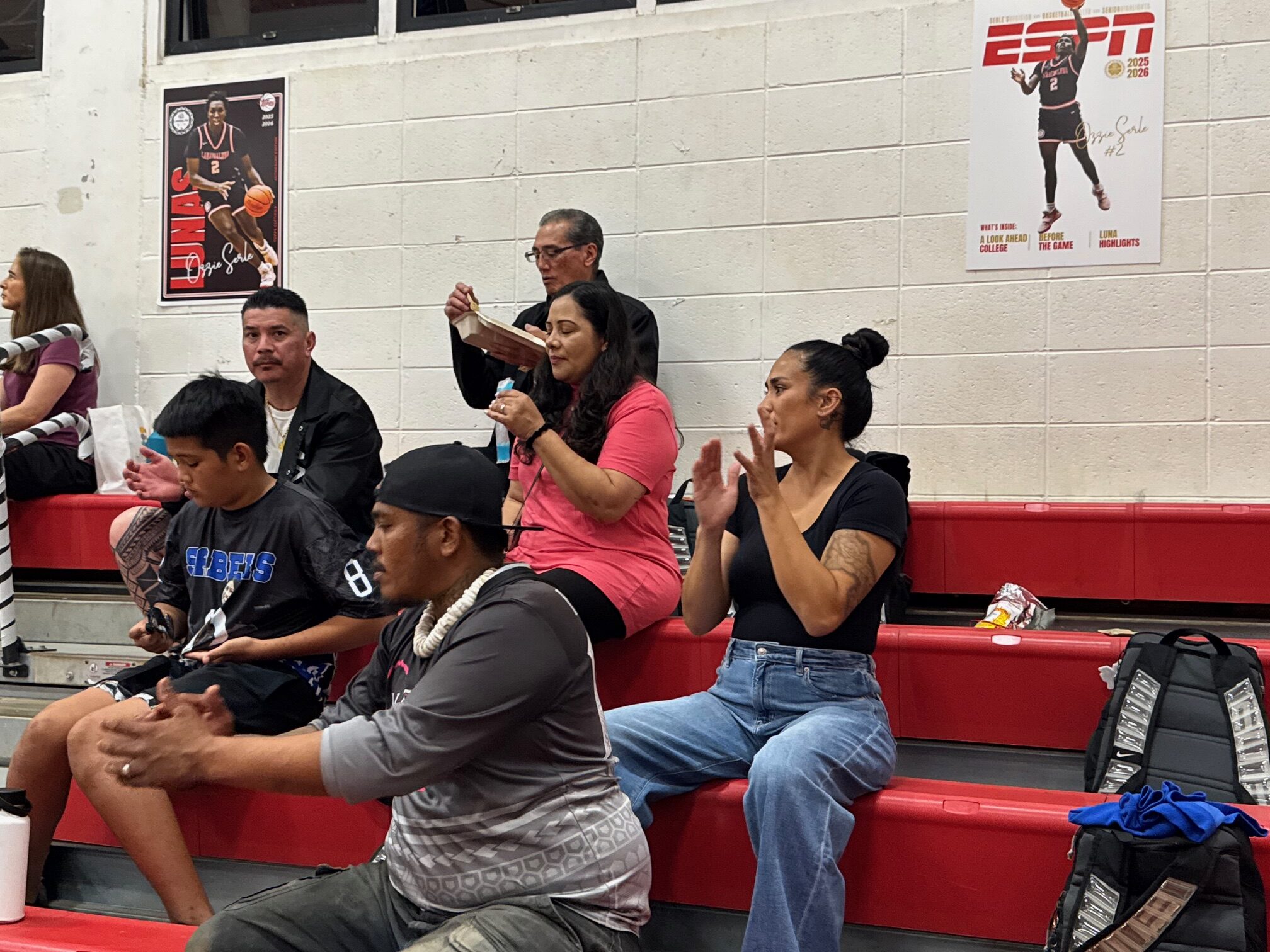 Naiara Bal's family, including her father Brandley Lanakila Bal (forefront). mom Crystal Bal (right) and grandfather Gilbert Silva (back) were in attendance for Naiara Bal's final regular-season MIL game at Lahainaluna on Friday evening. The Sabers won 55-31 to finish 12-0 in the MIL regular season. HJI / ROB COLLIAS photo
