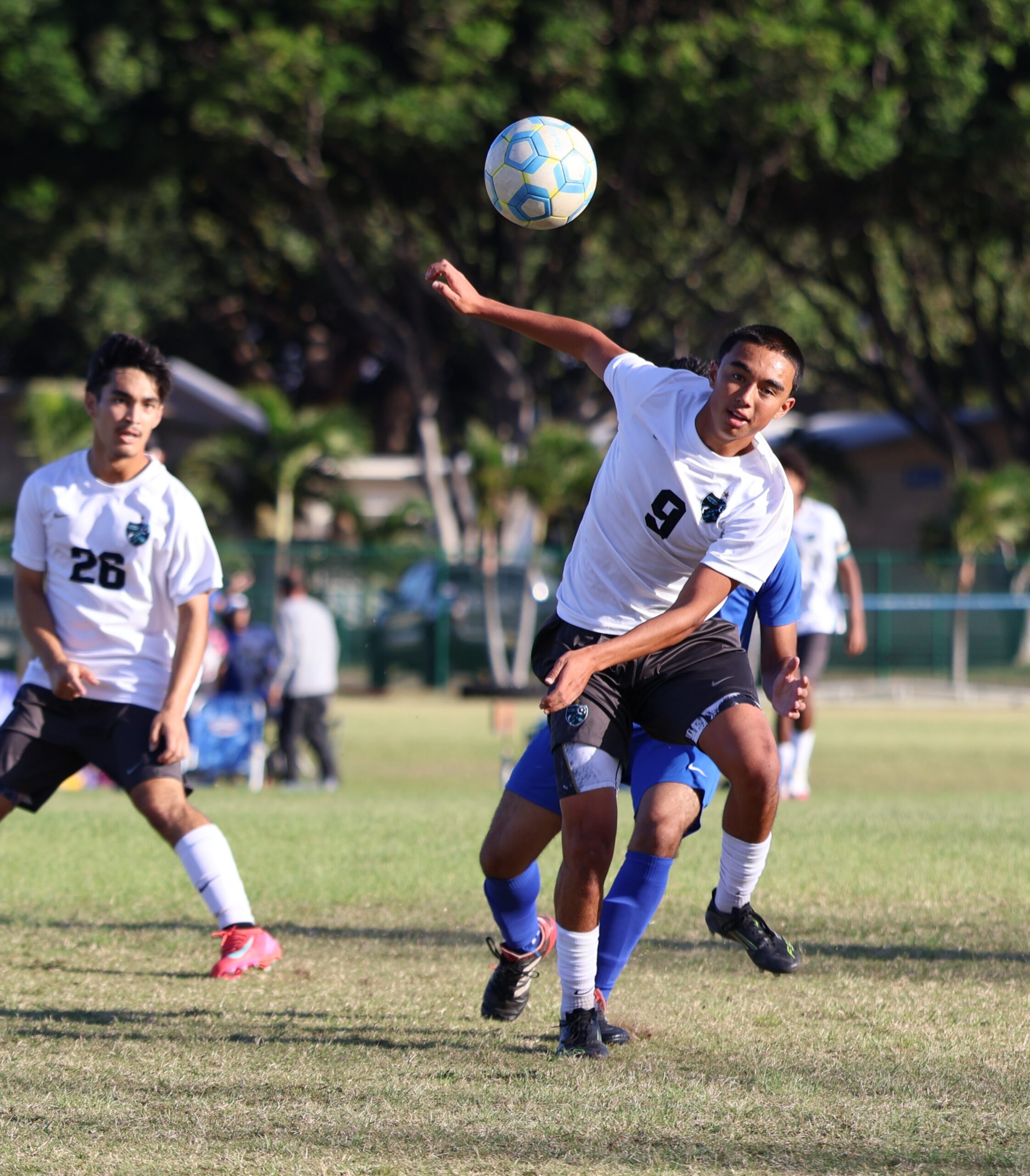 King Kekaulike High School's Makoa Kapuniai chases the ball in Na Ali'i's 4-1 win over Maui High on Saturday at the Sabers' on-campus field. King Kekaulike has clinched the boys Maui Interscholastic League title and are 10-0-0 so far in the MIL season. REID YAMAMOTO photo