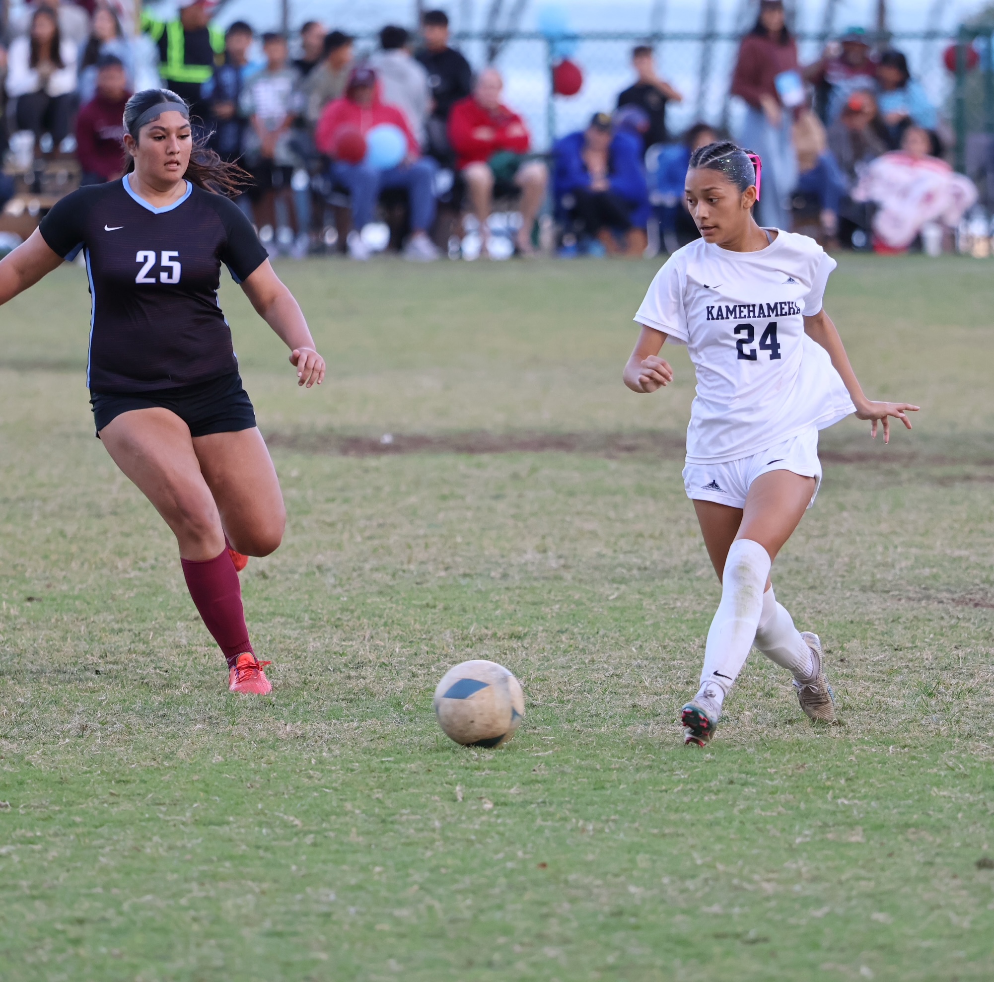 Kamehameha Maui's Kaui Joaquin (24) dribbles against Baldwin's Bella-Mae Bugtong (25) in the teams' 0-0 draw on Saturday. REID YAMAMOTO photo