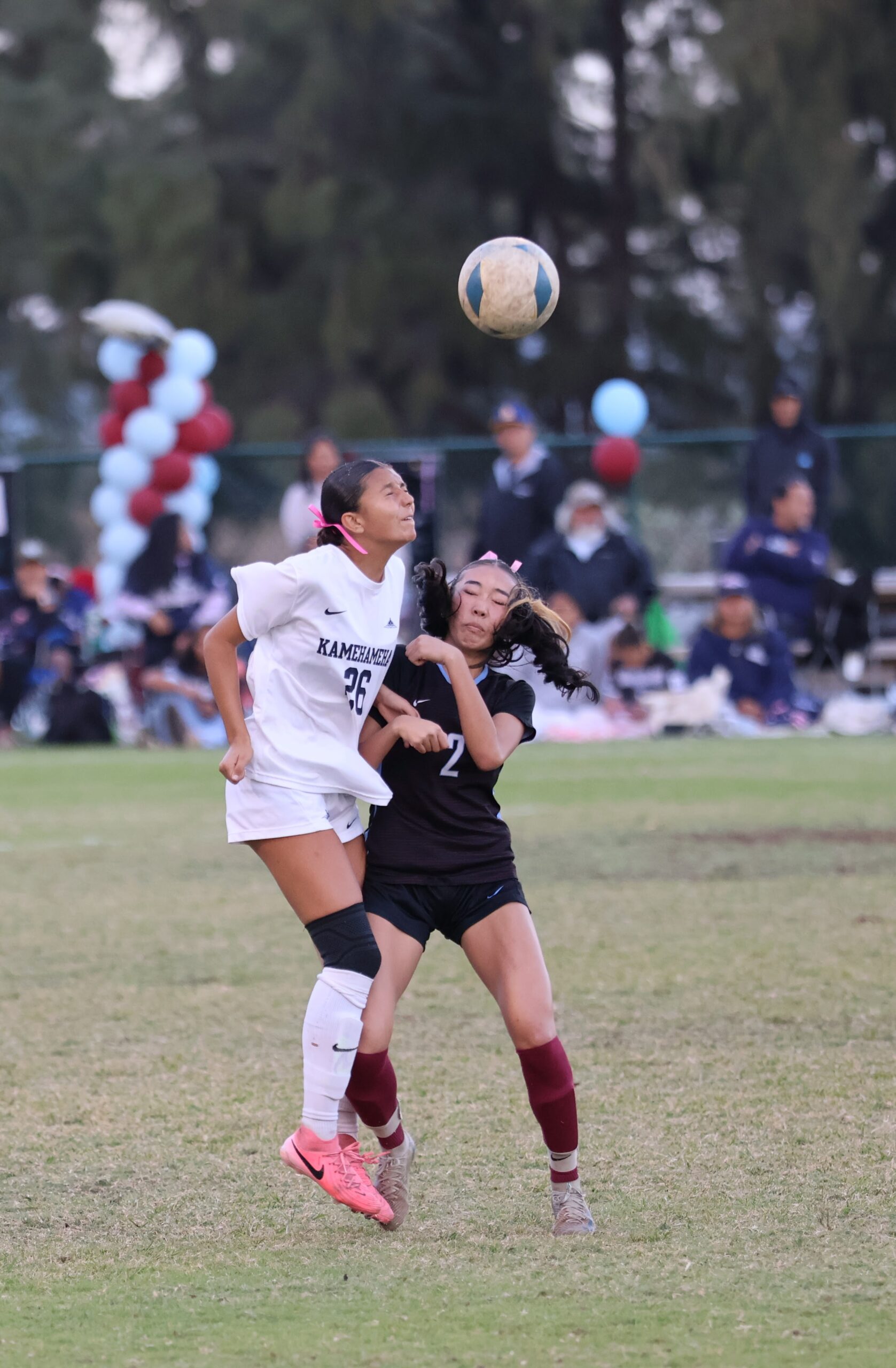 Kamehameha Maui's Leilei Loui heads a ball over Baldwin's Aiko Vaituulala on Saturday in the teams' 0-0 draw. Both teams finished 9-1-2 in the MIL, but the Bears won the championship via 1-0-2 head-to-head record against the Warriors. REID YAMAMOTO photo