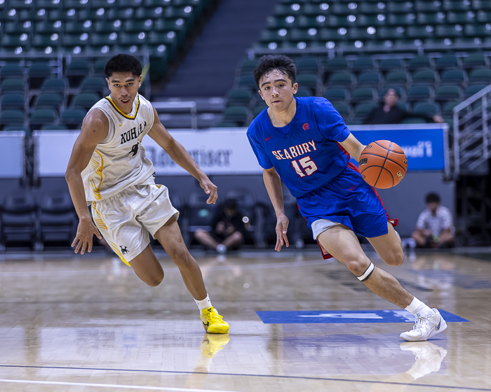 Seabury Hall's Sebastian Peterson dribbles past Kohala's Layden Kauka in the Division II state championship game on Friday. CJ Caraang | ScoringLive photo