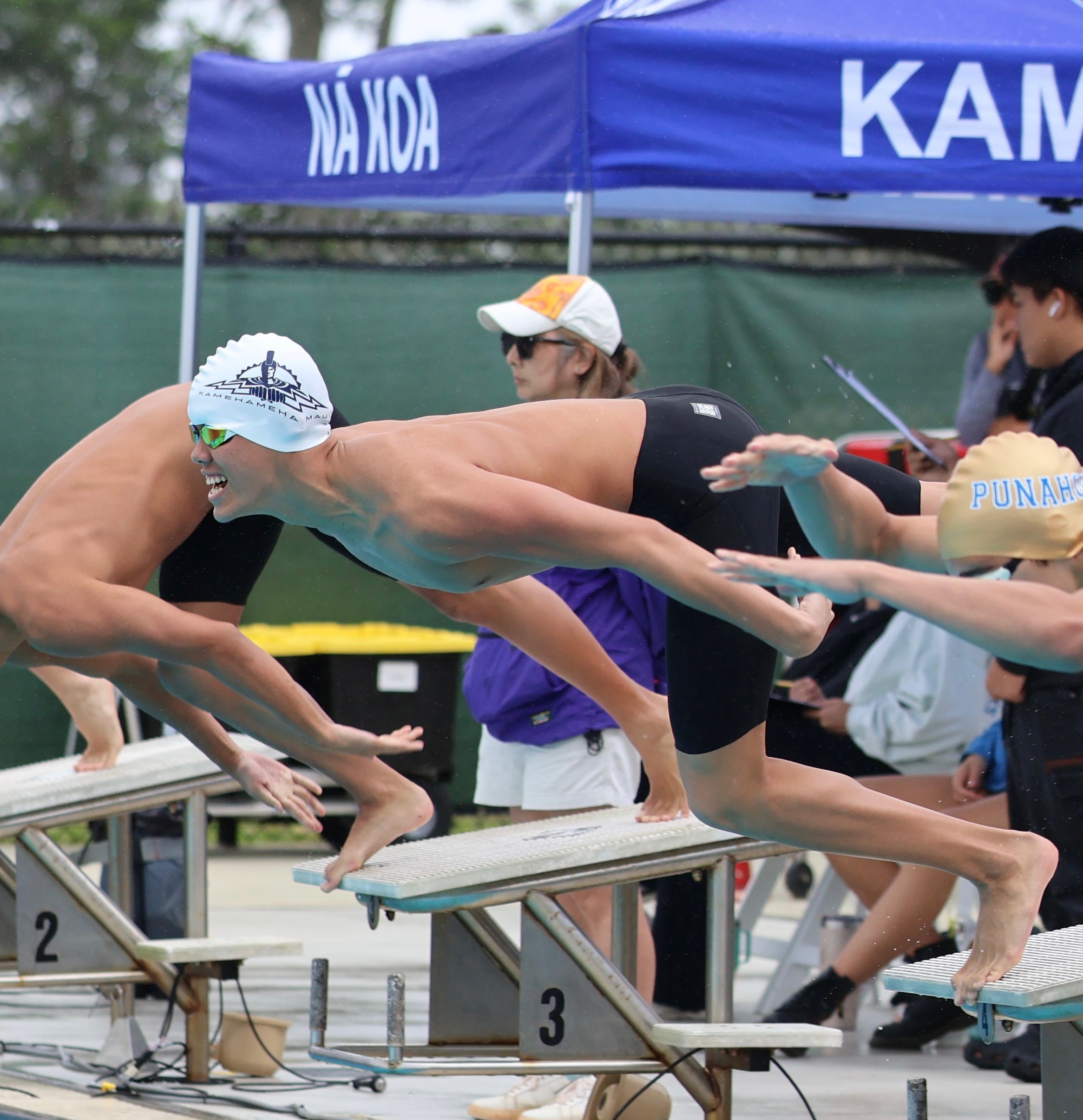 Kamehameha Schools Maui sophomore Cruz Storer dives in on the start of the 50-yard freestyle at the HHSAA/K. Mark Takai state swimming and diving championships on Saturday. Storer won both the 50- and 100-yard freestyles to become the first Kamehameha Maui state champion in swimming. REID YAMAMOTO photo