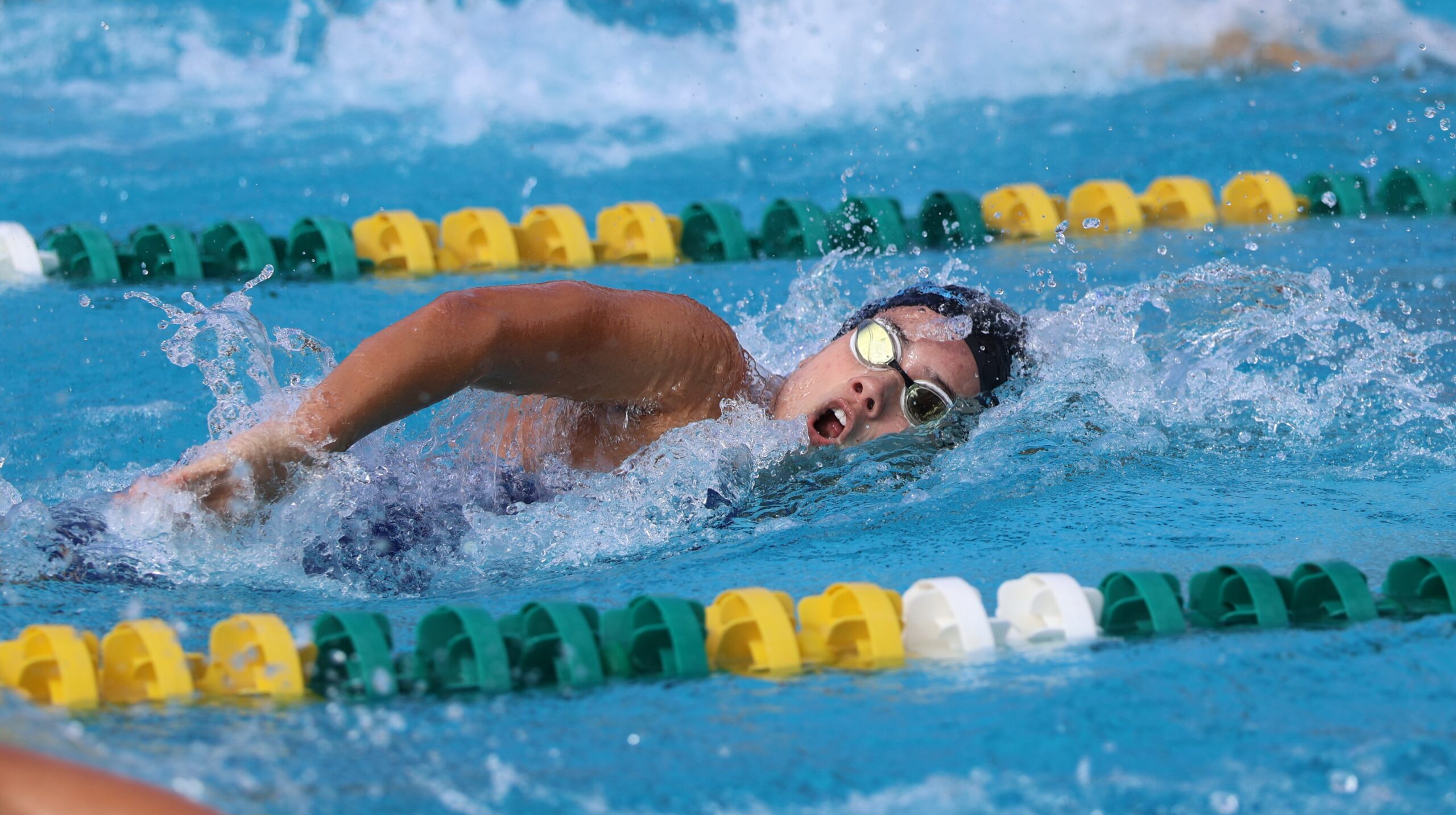 Maui High School's Aika Swanson swims in the 400-yard freestyle relay at the MIL swimming and diving championships on Saturday at Kihei Aquatic Center. REID YAMAMOTO photo