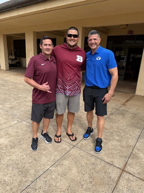 Three Baldwin High School football coaches — Jimmy Morimoto (left), Cody Nakamura (center) and Chad Kauha'aha'a — are shown in this photo take on the Baldwin campus earlier this month. Courtesy photo