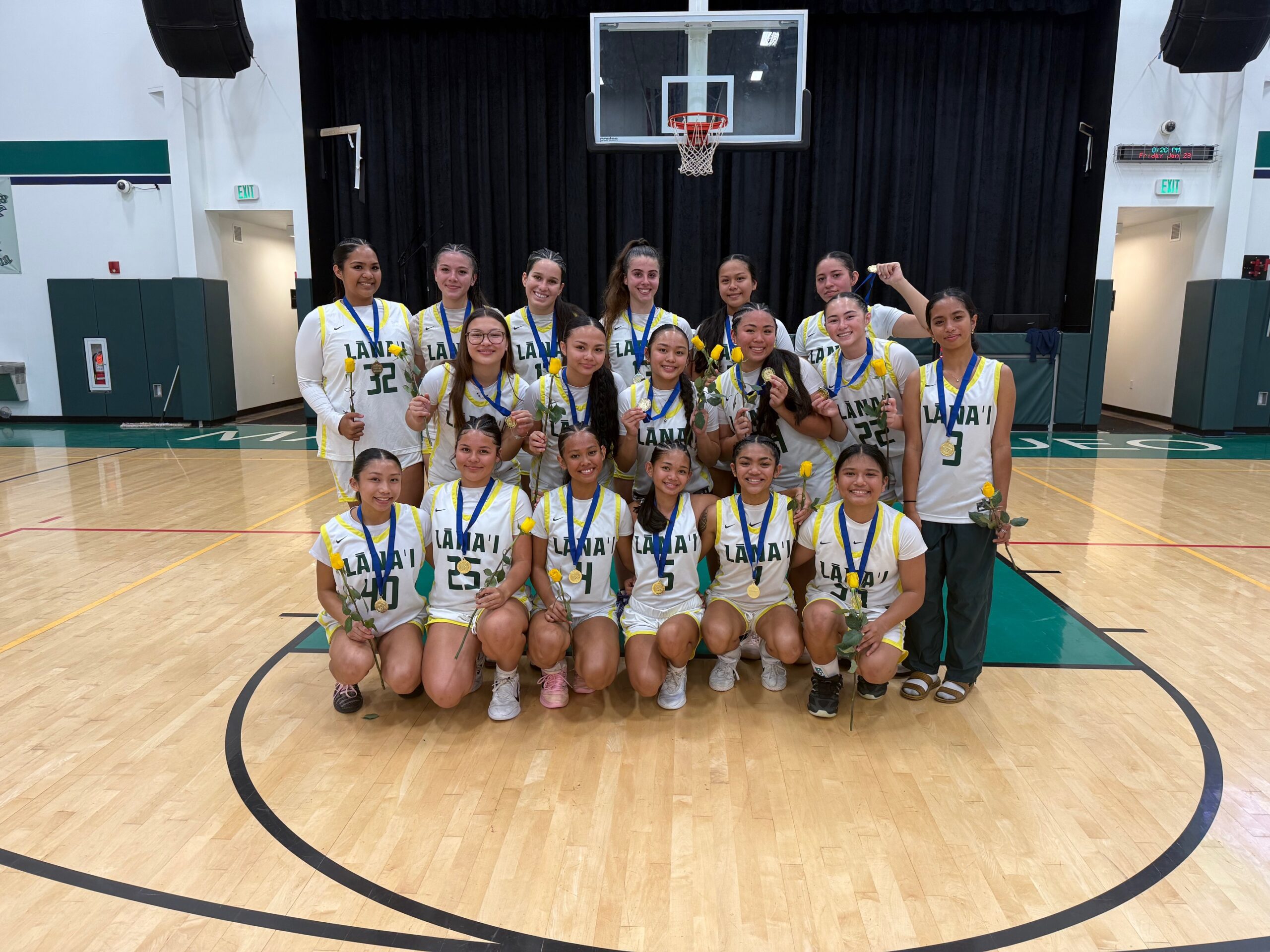 The Lānaʻi High School girls basketball team shows off their Maui Interscholastic League gold medals after they clinched their fourth straight Division II league championship. RODERICK SUMAGIT photo
