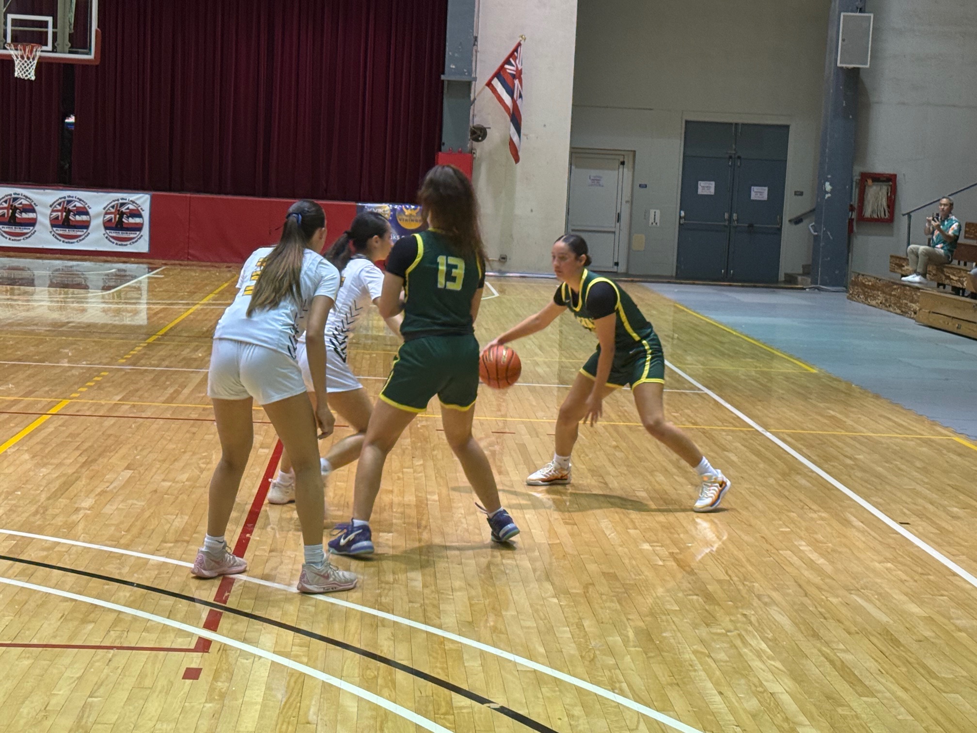 Lānaʻi High School's Alina Garbin dribbles the ball in the Hawai'i High School Athletic Association Division II state tournament semifinals against Hawai'i Baptist Academy while teammate Graziella Reese (13) sets a pick. HBA won the game 43-17. RODERICK SUMAGIT photo
