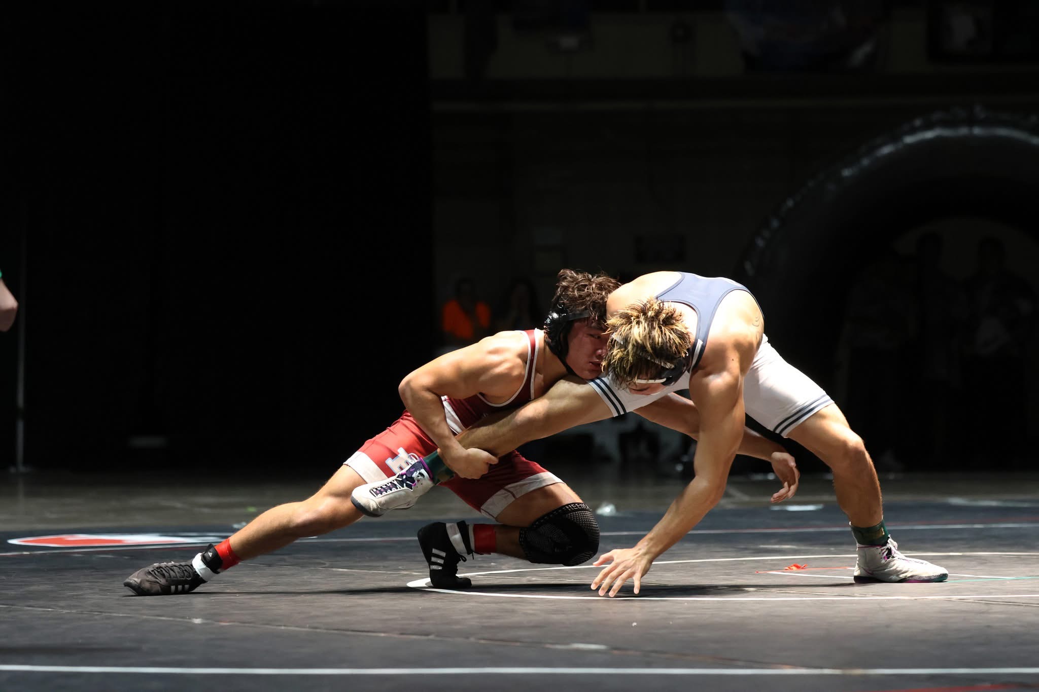 Baldwin High School's Niko Takitani takes down Kamehameha Kapalama's Hunter Paclib to win the boys 165-pound state title in overtime on Saturday. JASOn HAYASE photo