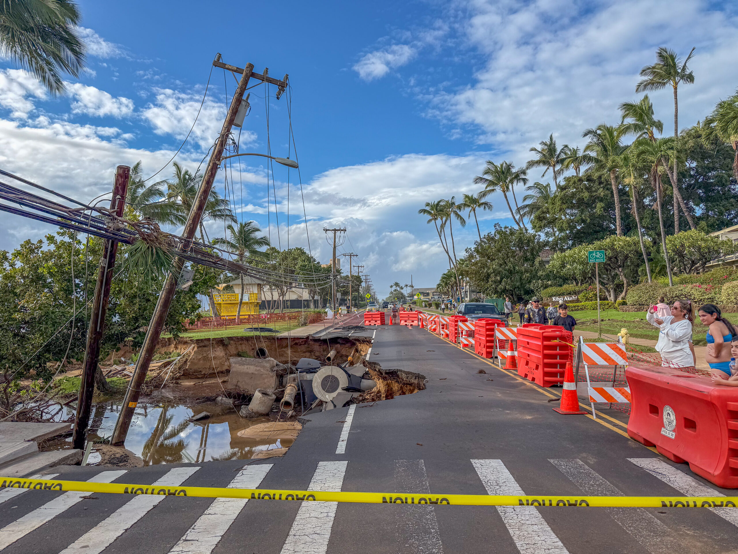 Due to coastal erosion from the kona low storm, a section of S. Kīhei Road in front of Kamaole Beach Park II collapsed and became a tourist attraction on March 16, 2026. HJI / Cammy Clark photo